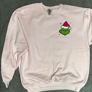 Rolling up Christmas spirt crewneck